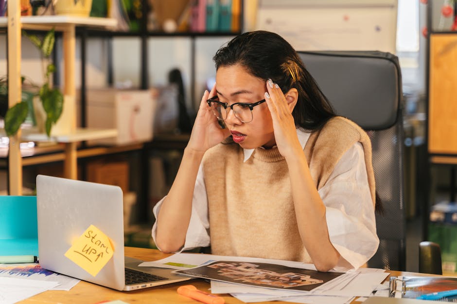 business owner looking stressed at computer