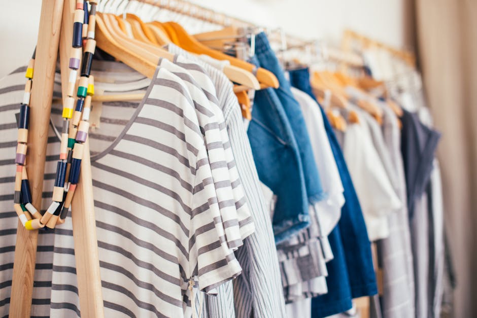 clothing rack with neatly organized neutral clothes