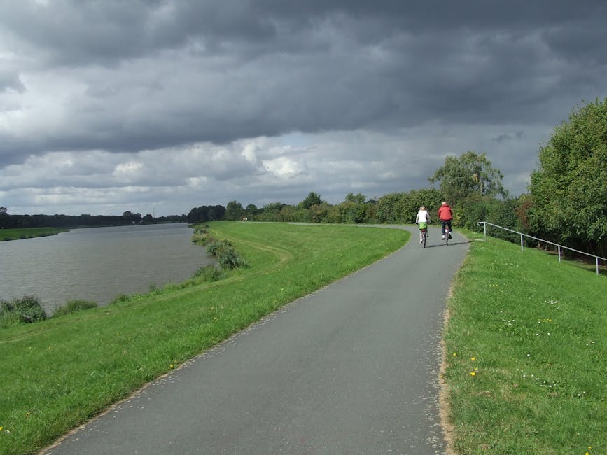 couple cycling along river