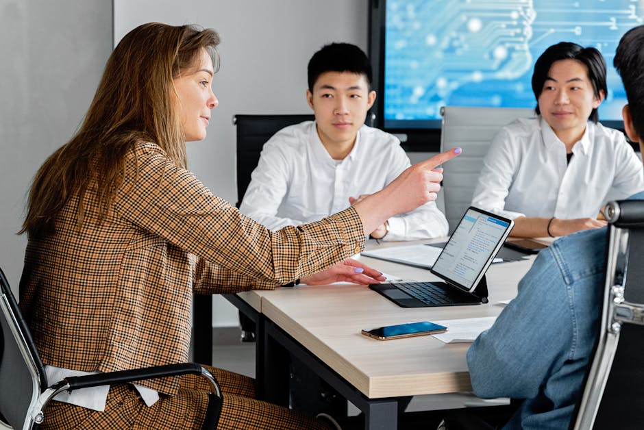 diverse team collaborating around a table with tablets