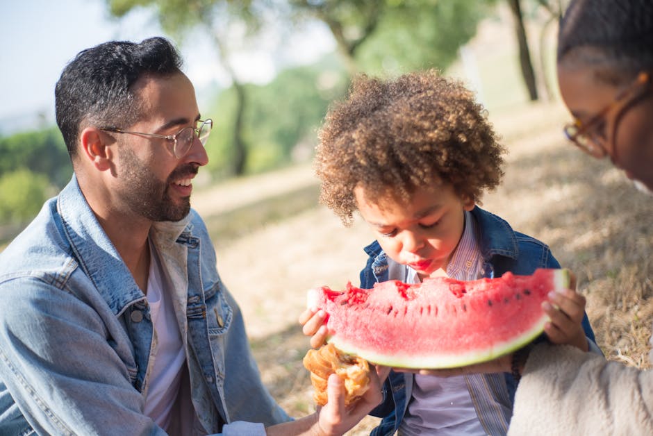 family eating picnic in nature
