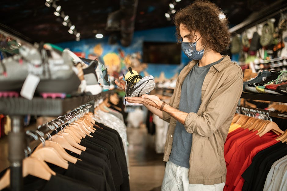 man checking out sneakers