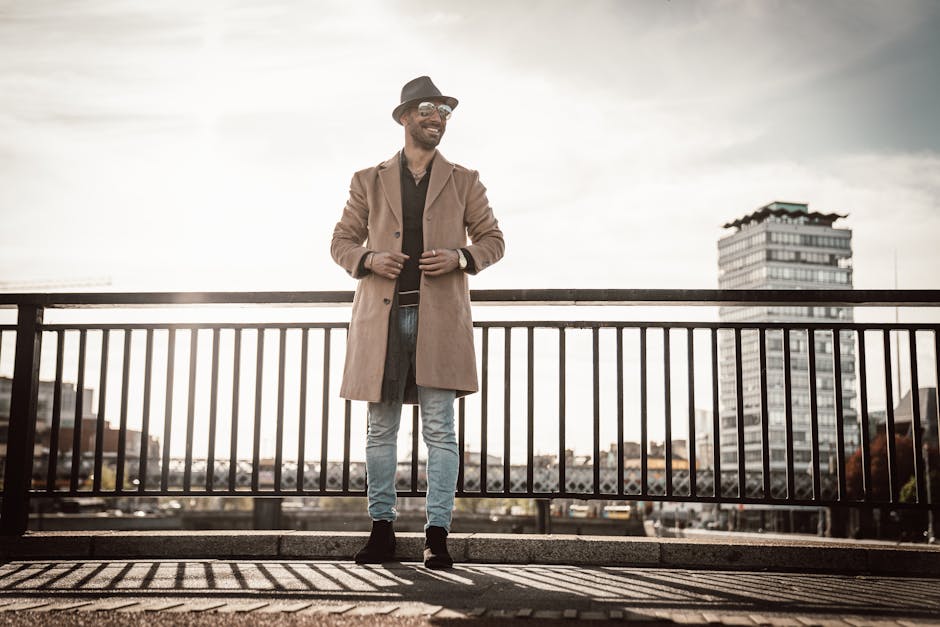 man in elegant autumn outfit walking in an old French city