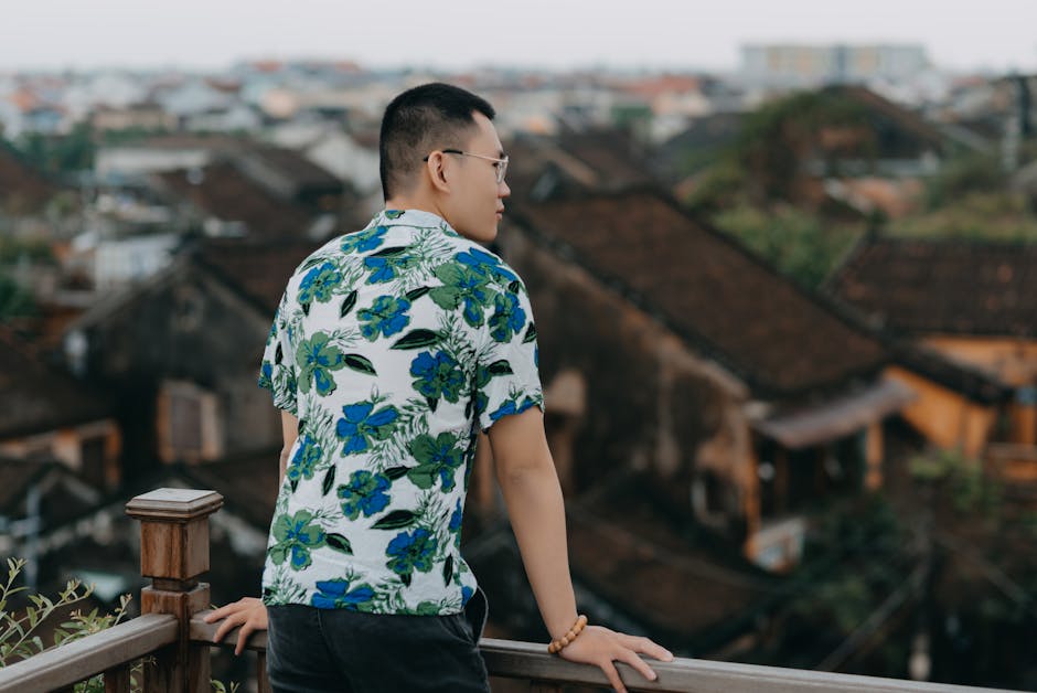 man in linen shirt on summer balcony