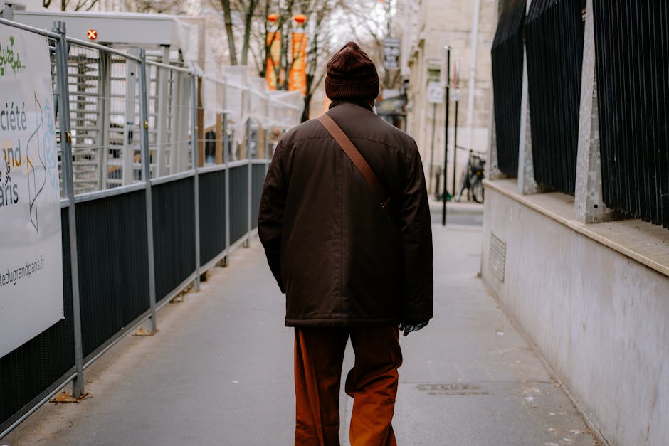 man walking city street france