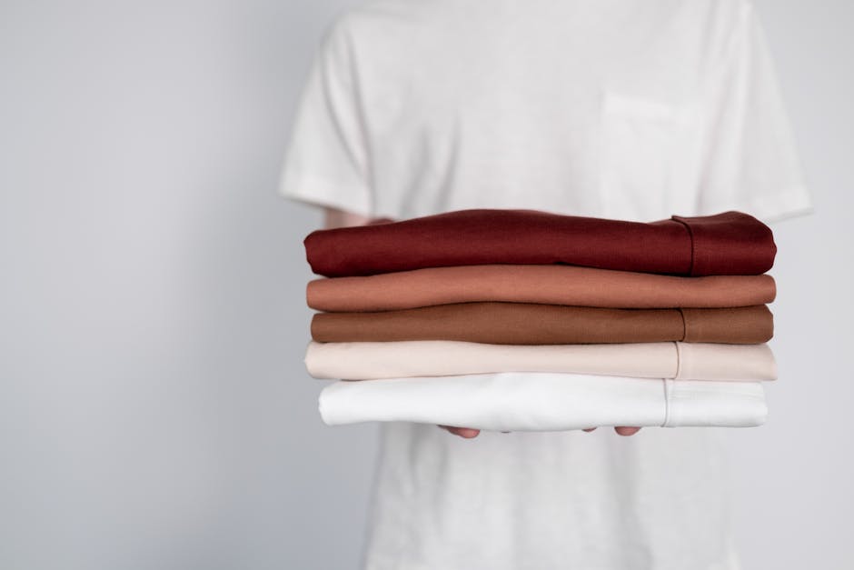 minimalist wardrobe with neatly folded clothes and accessories