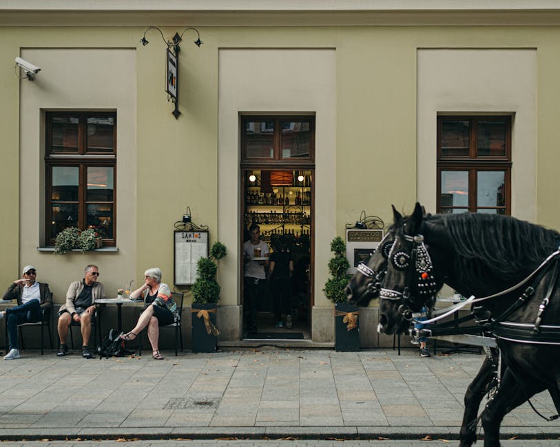 People enjoying summer outdoor cafe in Krakow