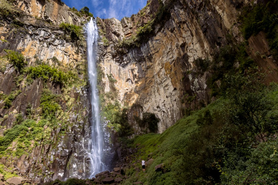 person hiking beautiful brazilian waterfall