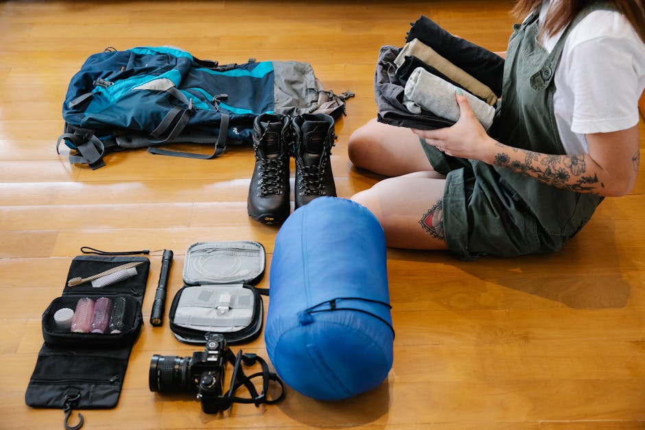 person packing travel backpack