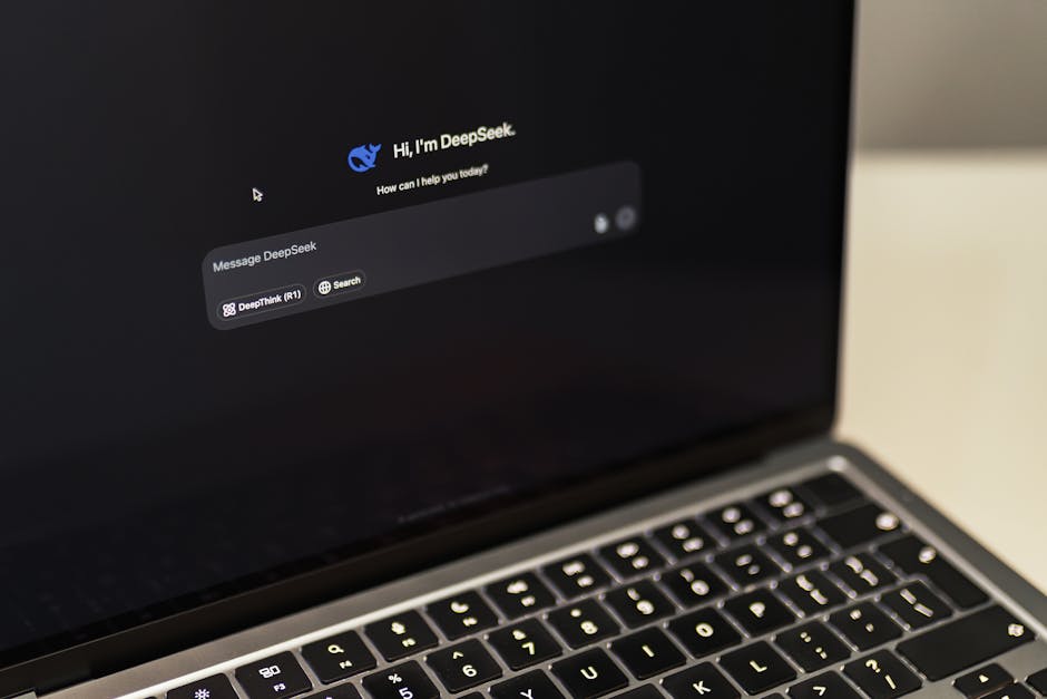 person writing on laptop with AI suggestions