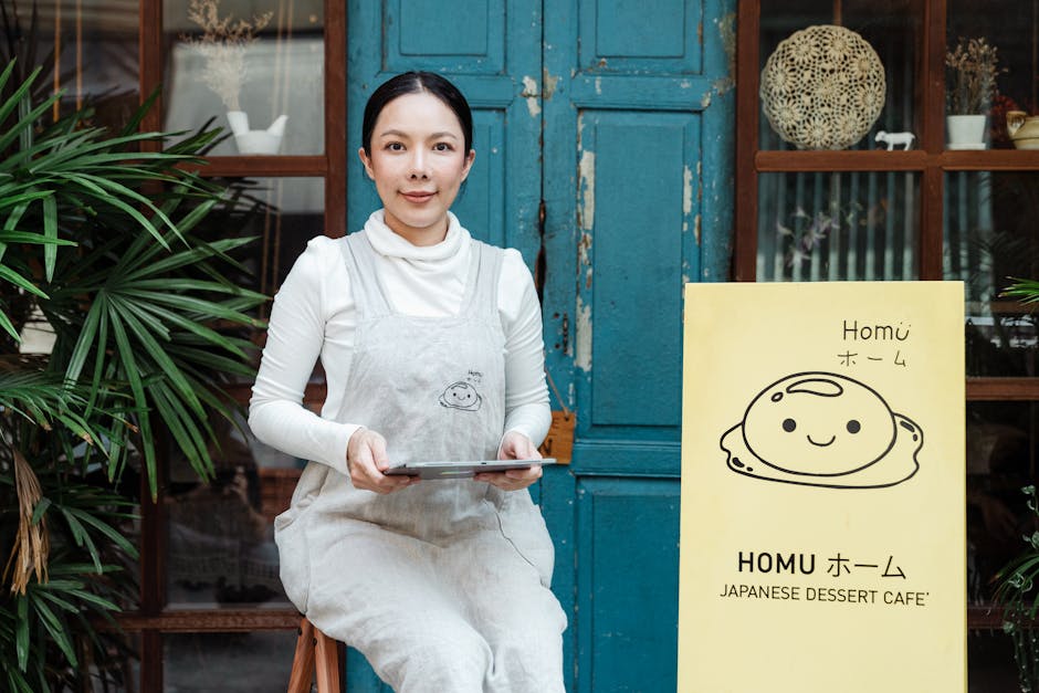 small business owner talking to customer in a cafe with tablet