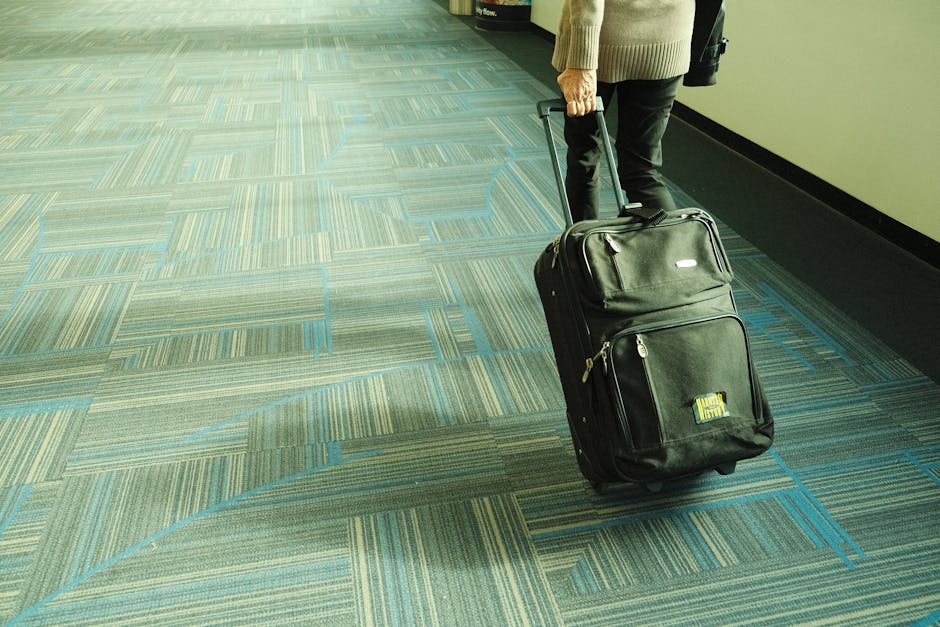 traveler walking airport luggage