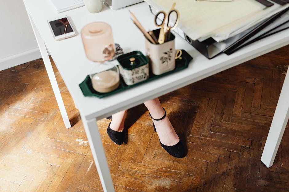 woman changing shoes in office