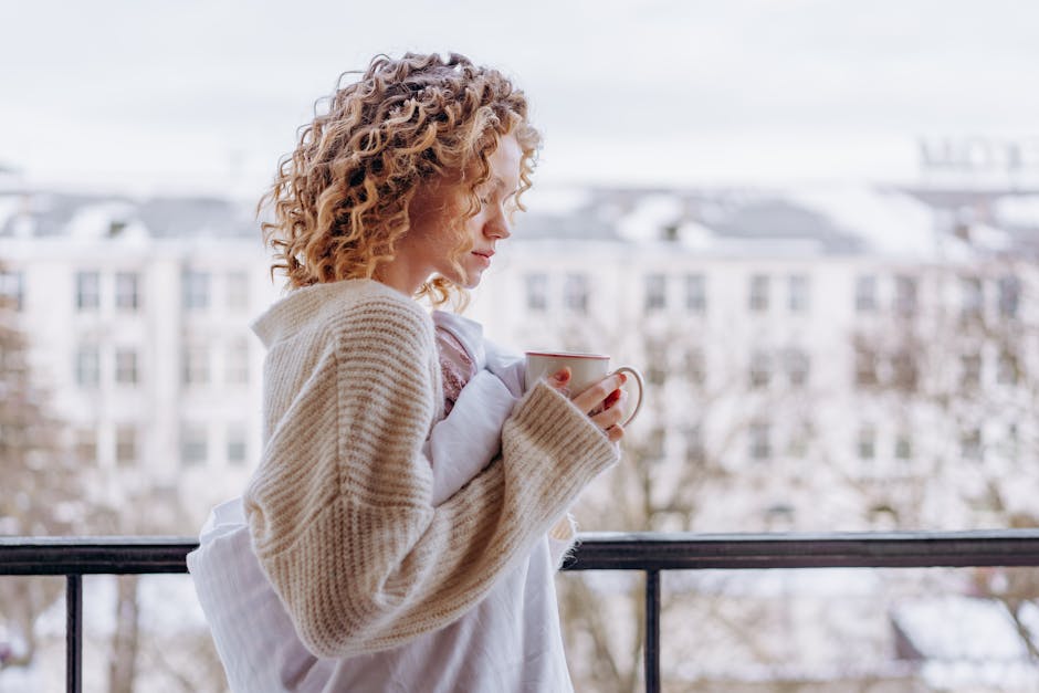 woman drinking coffee outside winter