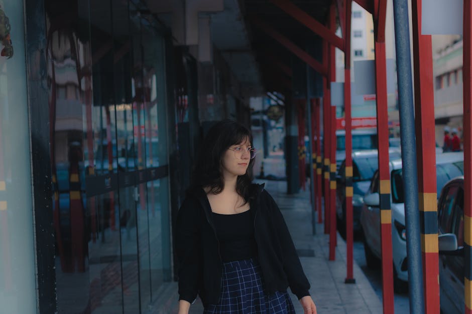 woman in jeans jacket and skirt in city