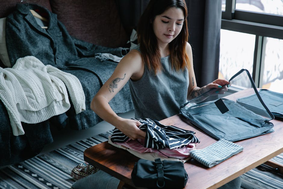 Woman organizing clothes with packing cubes