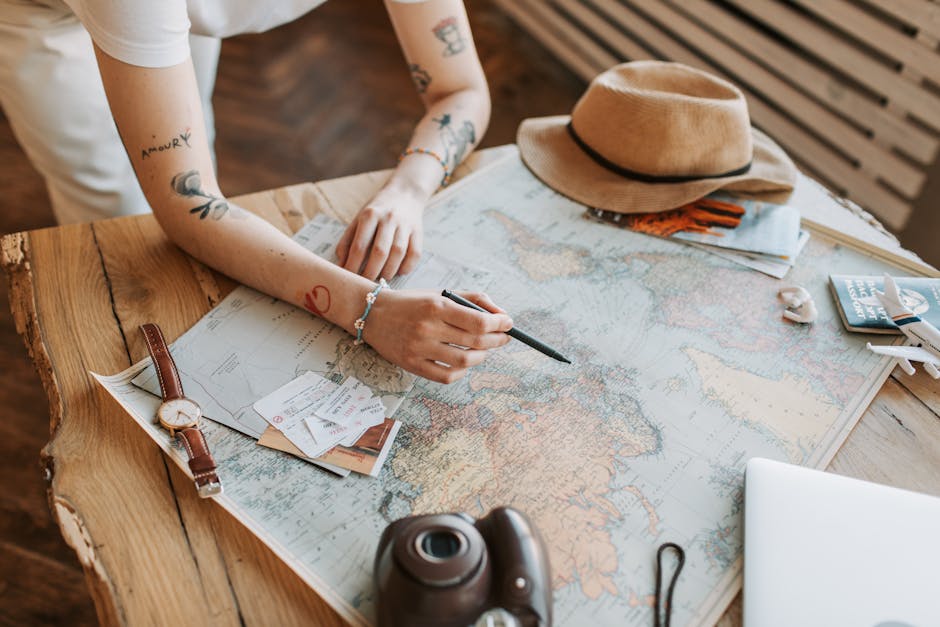 woman organizing travel documents and maps