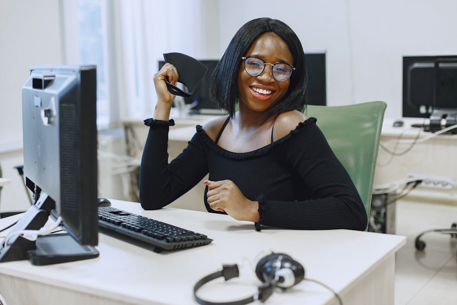 woman smiling at desktop