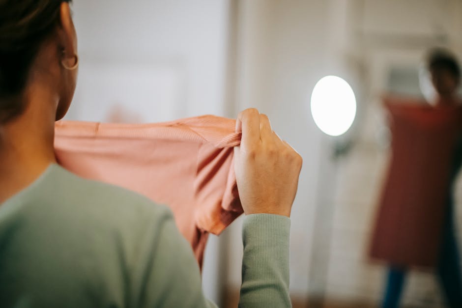 woman trying on clothes in bright room
