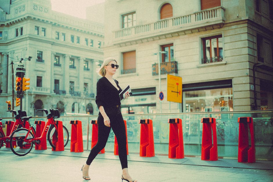 woman walking in city in stylish outfit