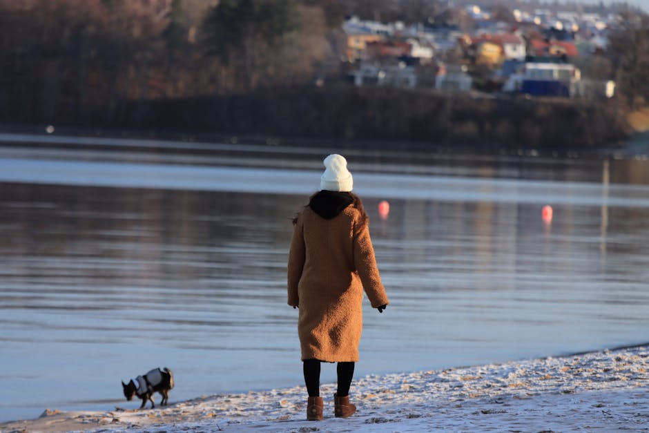 woman walking winter coat hat