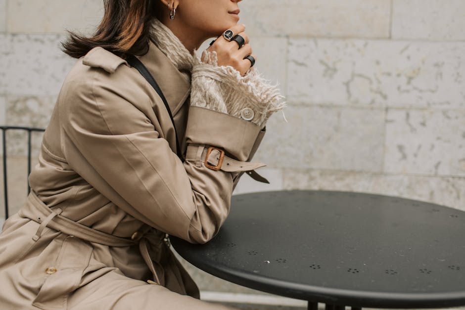 woman wearing beige trench coat in paris