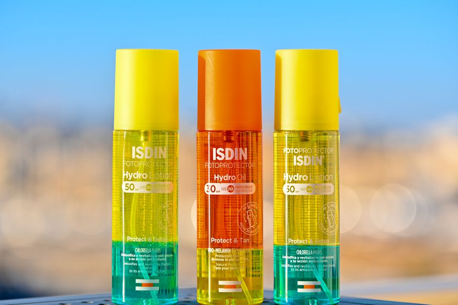 Two distinct sunscreen bottles, one labeled 'mineral' and the other 'chemical', side-by-side for comparison.