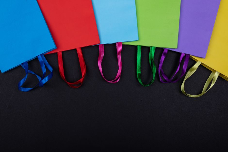 A flat lay comparison of various bag types: a sleek backpack, a modern messenger bag, and a compact crossbody bag, illustrating different functionalities.