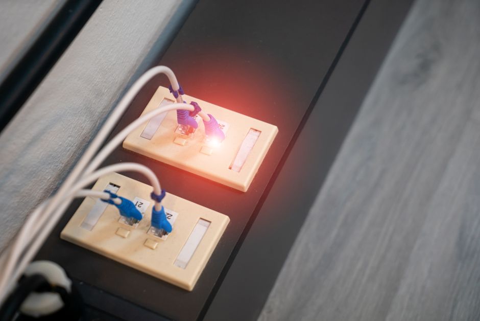 An advanced Wi-Fi router with multiple antennas positioned centrally in a modern living room to maximize home network coverage.