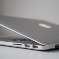 Laptop screen showing power optimization settings with various options for extending battery life