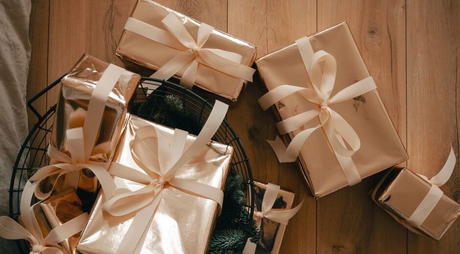 A carefully curated beauty gift set featuring a gentle cleanser, a hydrating serum, and a broad-spectrum sunscreen, neatly arranged on a natural wood surface with soft lighting, suitable for various skin types.