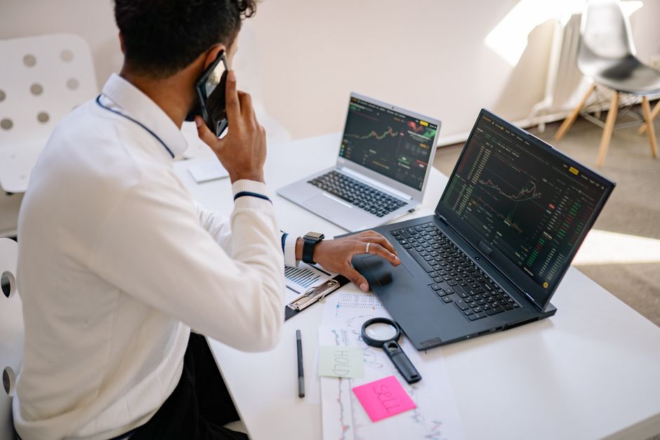 A small business owner reviews CRM analytics on a laptop, showing charts of customer engagement and sales performance.